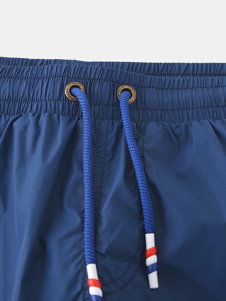 Schnelltrocknende, einfarbige Strand-Boardshorts für Herren mit Kompressionsfutter und Kordelzug